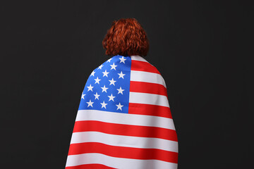 Woman with flag of USA on dark background. National Day of Prayer and Remembrance for the Victims...