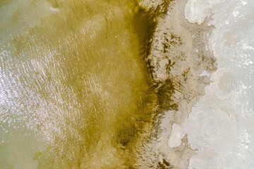 Texture of lake water and sandy beach on Antelope Island, Syracuse, Utah, United States of America.