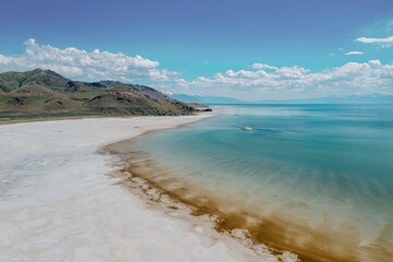 Beach shoreline and mountain range of The Great Salt Lake from Antelope Island, Syracuse, Utah, USA