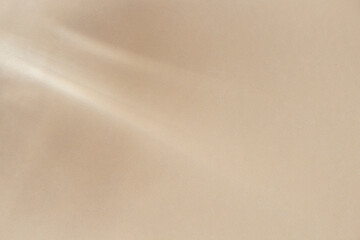 Obraz premium Minimal summer background concept in beige sand color with light shadow on the wall.Creative copy space for overlay on product presentation,posters,mockup,blogs,templates,books.Trendy empty showcase.