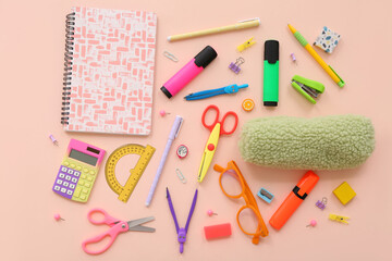 School supplies with scissors, markers and pencil case on beige background. Top view
