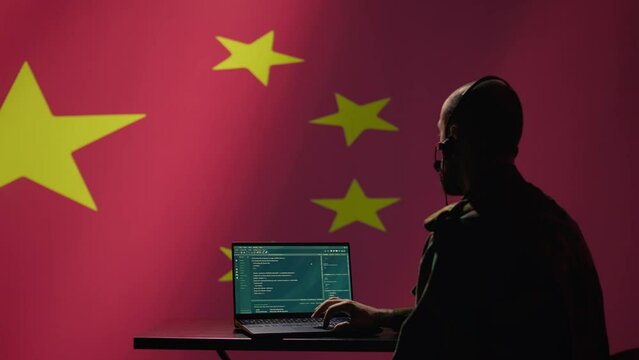 China military engineer creating fake accounts on social media to persuade other nations to act in the Chinese government interests. CCP intelligence operator spreading misinformation online, camera B