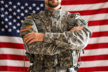 Male soldier against USA flag, closeup. Labour Day celebration