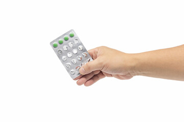 Close up of a male hand holding foil plate of medicine isolated on white background