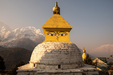 Tibetan Buddhist stupa with himalayas mountain in the background seen from Pangboche village, Nepal.