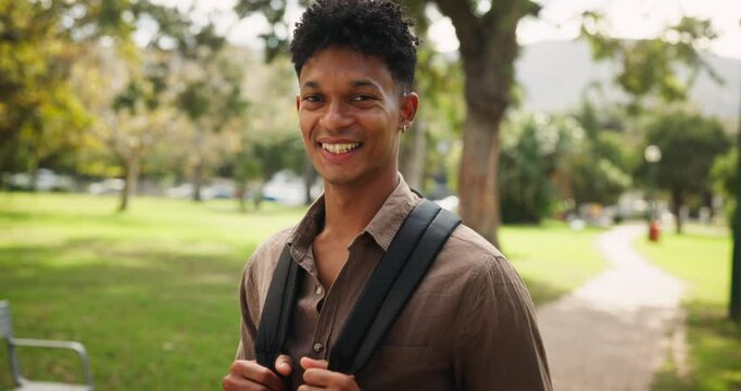 University, face and happy man with backpack at campus park for education, learning or future career goal outdoor. College, scholarship or portrait of gen z male student outside for study opportunity