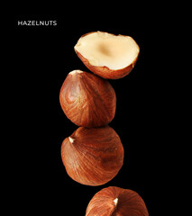 Creative layout made of hazelnut on the black background. Food concept. Macro concept.