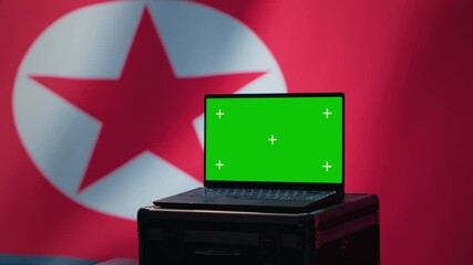 Isolated screen laptop in Pyongyang intelligence command center used by dictatorship party to run security protocols against NATO and South Korea enemies, isolated over North Korea flag, camera A - Powered by Adobe