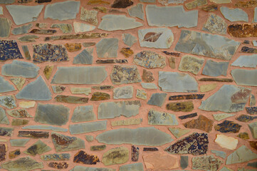 A view of a decorative stone and cement wall.