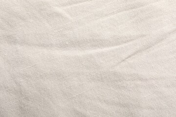 Naklejka premium Texture of beige fabric as background, top view