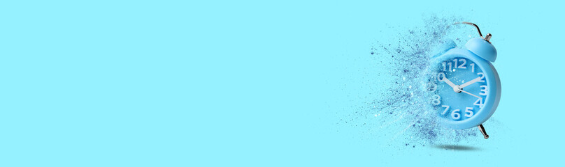Alarm clock dissolving on light blue background, banner design with space for text. Flow of time