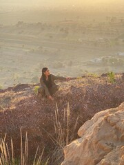 Young Mexican Girl with triumph pose in the top of a mountain in San Jer&oacute;nimo Tecuanipan, Puebla, Mexico