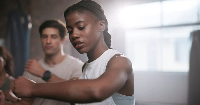 Woman, training and personal trainer with boxer for self defense, workout or exercise at indoor gym. Female person or fighter with coach for punching, martial arts or boxing together at health club