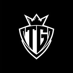 TG Letter logo with sharp triangle shield shape with crown inside white outline on black background template design