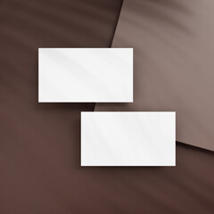Blank business cards on brown background
