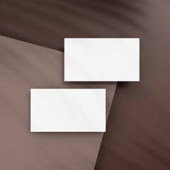 Blank business cards on brown background