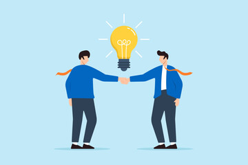 Two businessman handshake with glowing light bulb concept innovation collaboration and creative partnerships