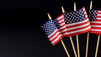 selective focus of USA national flags isolated on black, Memorial Day concept