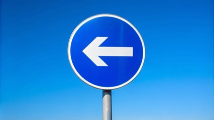 Isolated traffic sign against clear blue sky indicating merge left with arrow symbol, no vehicles or pedestrians in sight.