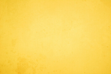 Yellow concrete stone texture for background in summer wallpaper. Cement and sand wall of tone vintage minimal. Concrete abstract wall of light yellow color, cement texture white blank for home decor.