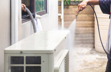 Technician man team cleaned mold in the air conditioning system, Repairman washed dirty air conditioner, Maintenance and service concepts