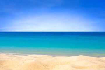 Obraz premium Nature of the beach and sea Summer with sunshine, sandy beaches, clear blue waters sparkling against the blue sky. On an island with good ecology and environment Background for summer vacation concept
