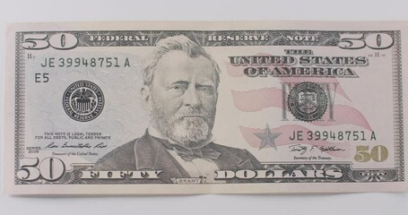American fifty dollar paper banknote in close up macro. Fifty USD cash macro view. 50 Dollar Cash Stop Motion. Fifty Dollar Closeup. Stop Motion of 50 USD Bills. American fifty dollar banknote. - Powered by Adobe