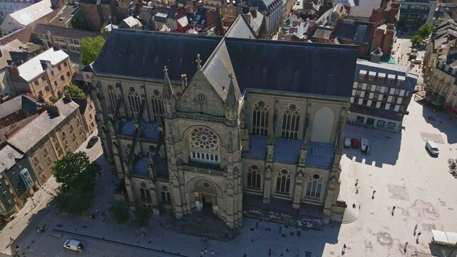 Basilica Saint-Aubin in Place Sainte Anne square, Rennes in France. Aerial backward