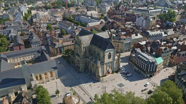 Basilica Saint-Aubin in Place Sainte Anne square and Jacobins convent in Rennes, France. Aerial drone orbiting