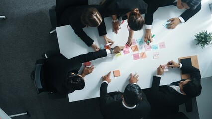 Top down ariel view of professional business team use colorful sticky notes brainstorming idea at...