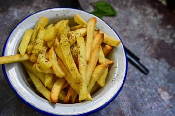  Home made   Fresh fried French fries  in a bowl on wooden rustic  background