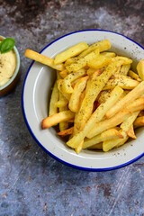  Home made   Fresh fried French fries  in a bowl on wooden rustic  background