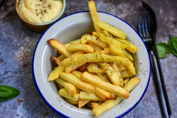  Home made   Fresh fried French fries  in a bowl on wooden rustic  background
