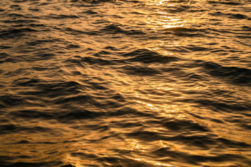 Summer background, nature of tropical golden beach with rays of sun light.