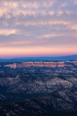 Witness the aweinspiring sunset view of Bryce Canyon National Park in Utah, featuring the rugged rocks and vibrant colors of the sky during this extraordinary scene of natural beauty