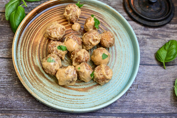 Homemade Swedish Meatballs  With creamy gravy sause in black pan skillet.Swedish cuisine.