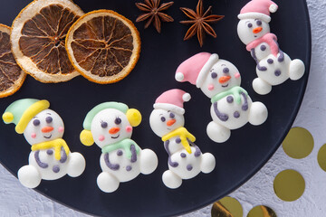 Christmas marshmallows. Winter candy. Sweet food in december. Snowman and Santa Claus