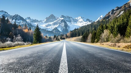 Naklejka premium An asphalt road leading through a mountain
