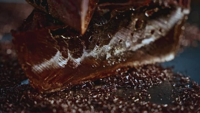 Close up of mica material on a blurred background in sun rays. Stock footage. Natural materials and geology concept.