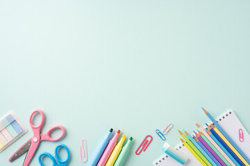 Colorful school stationery supplies arranged on a pastel background. Ideal for back to school themes or educational materials