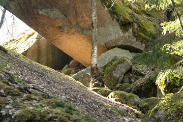Beautiful huge boulders in the Tividen National Park in Sweden. Natural springtime scenery of forest in Scandinavia.