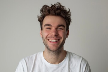 Fototapeta premium Portrait of attractive glad cheerful man over neutral background