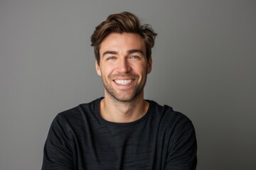 Fototapeta premium Portrait of attractive glad cheerful man over neutral background