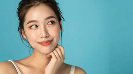 close up beauty shoot of a female asian against blue background with different expressions