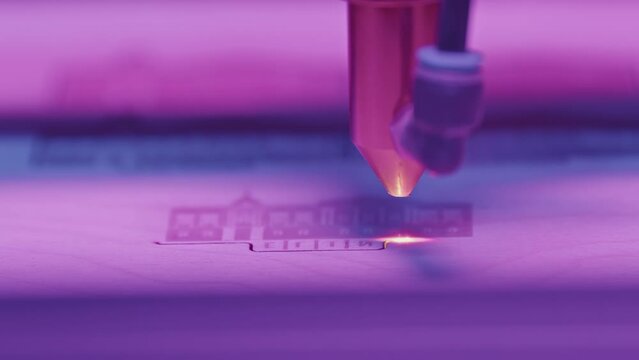 Close-up of laser printer engraving patterns. Media. Dot laser engraves patterns in robotic printer. Laser printers for fine engraving on any material
