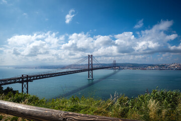Scenic Vista of 25 de Abril Bridge spanning the Tagus River - Lisbon, Portugal