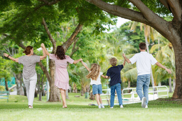 Fototapeta premium Family with children walking at the park.