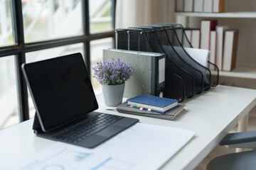 Picture of a desk in the office calculator equipment Workbook to calculate the financial results of the company in the office and work, taxes, accounting, statistics and online business ideas.