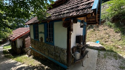  Immerse yourself in the cultural heritage of an ethno village with this captivating photograph of an old retro house. 