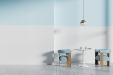 Cozy cafe interior with round table and soft chairs. Mockup wall